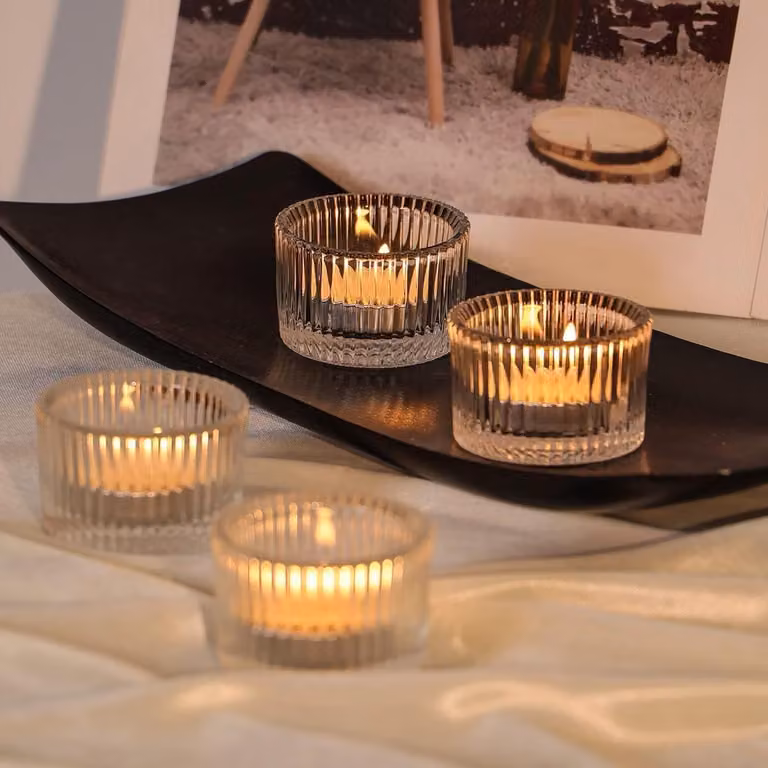 Set van 12 heldere theelichthouders van dikwandig glas met een diameter van 5,5 cm