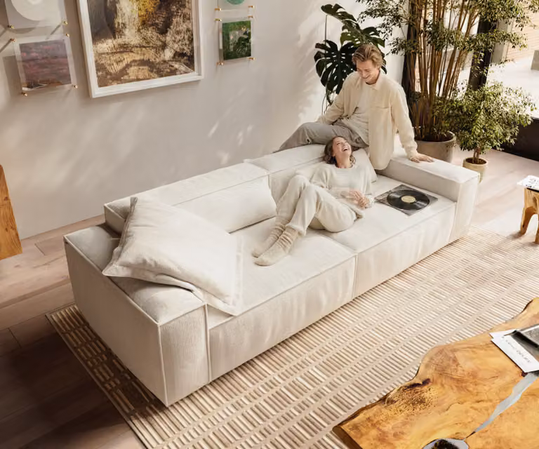 DELIFE Freestyle Cozy bank in beige bouclé met losse rugkussens en zitkussens, B: 280 cm, D: 110 cm